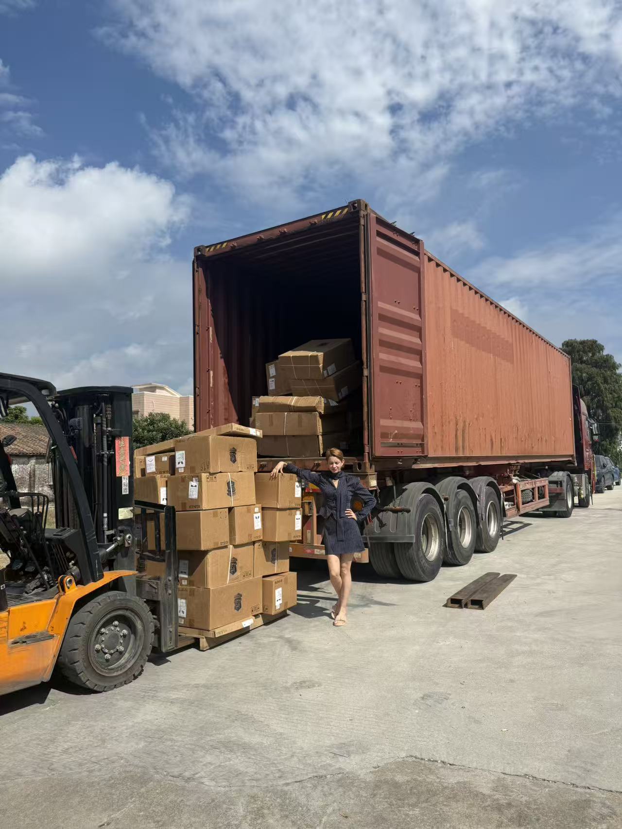 Container loading area with a forklift and cargo boxes